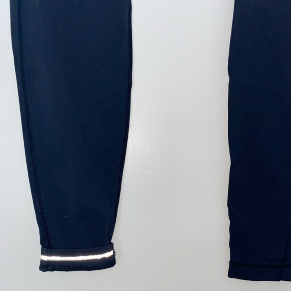 lululemon mid-rise teal leggings, with side pockets and zipper in back - Picture 2 of 3